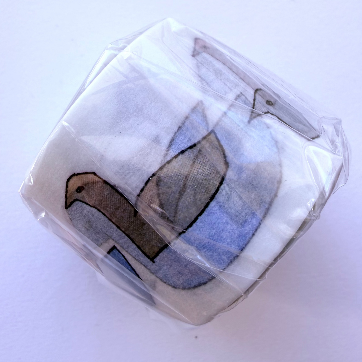 Washi tape roll with swan design on white background