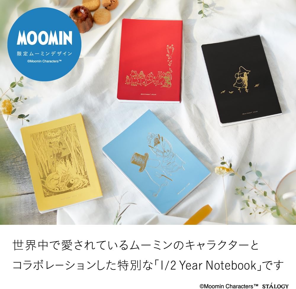 Four Moomin-themed notebooks in red, black, yellow, and blue on a white surface with flowers.