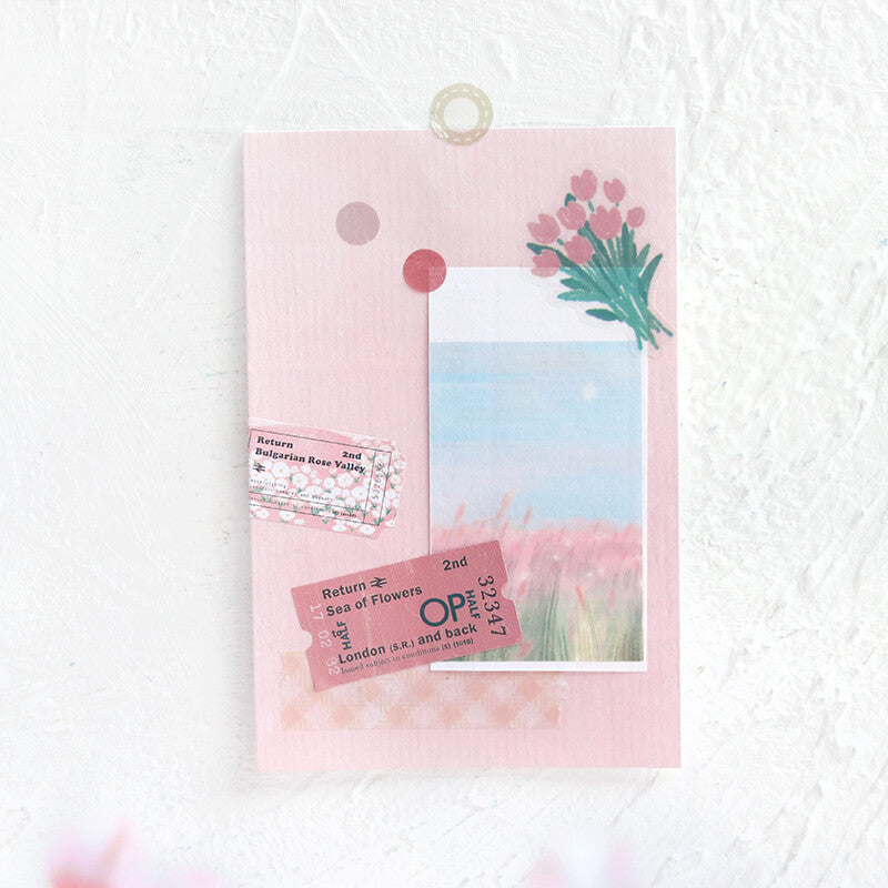 Card with scenic design and floral elements on a white background