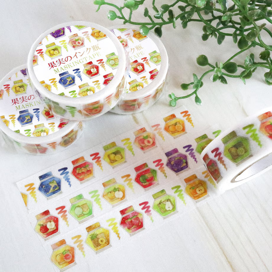 Decorative washi tape with colorful designs on a white surface.