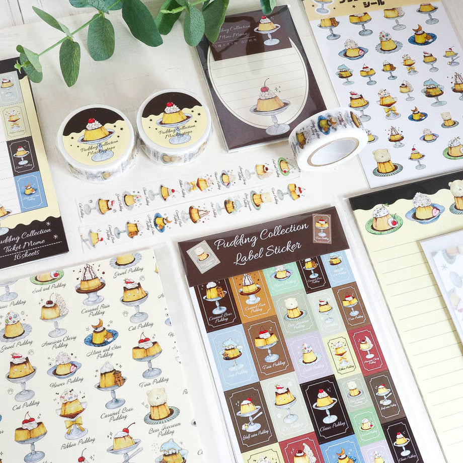 Collection of pudding-themed stickers on a white surface with a plant in the background.