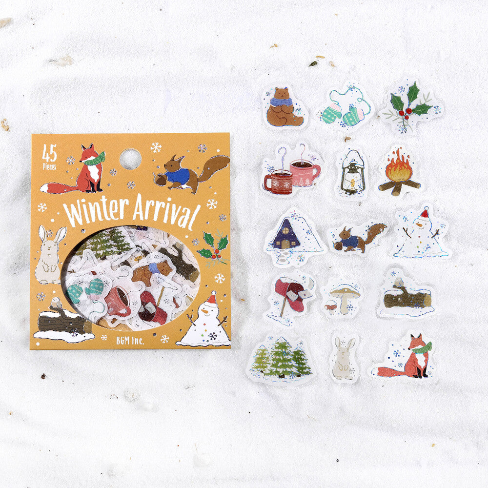 Sticker set with winter-themed designs on a snowy background