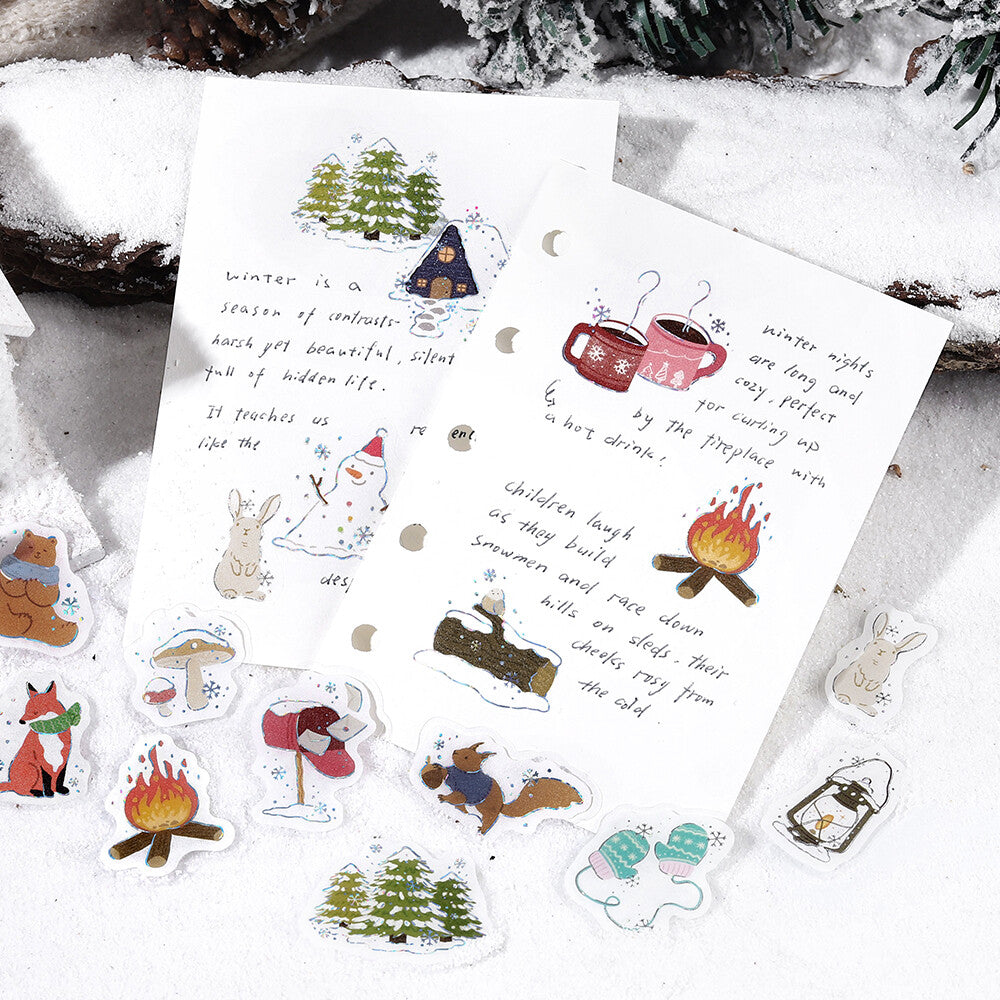 Set of winter-themed stickers with illustrations on a snowy background