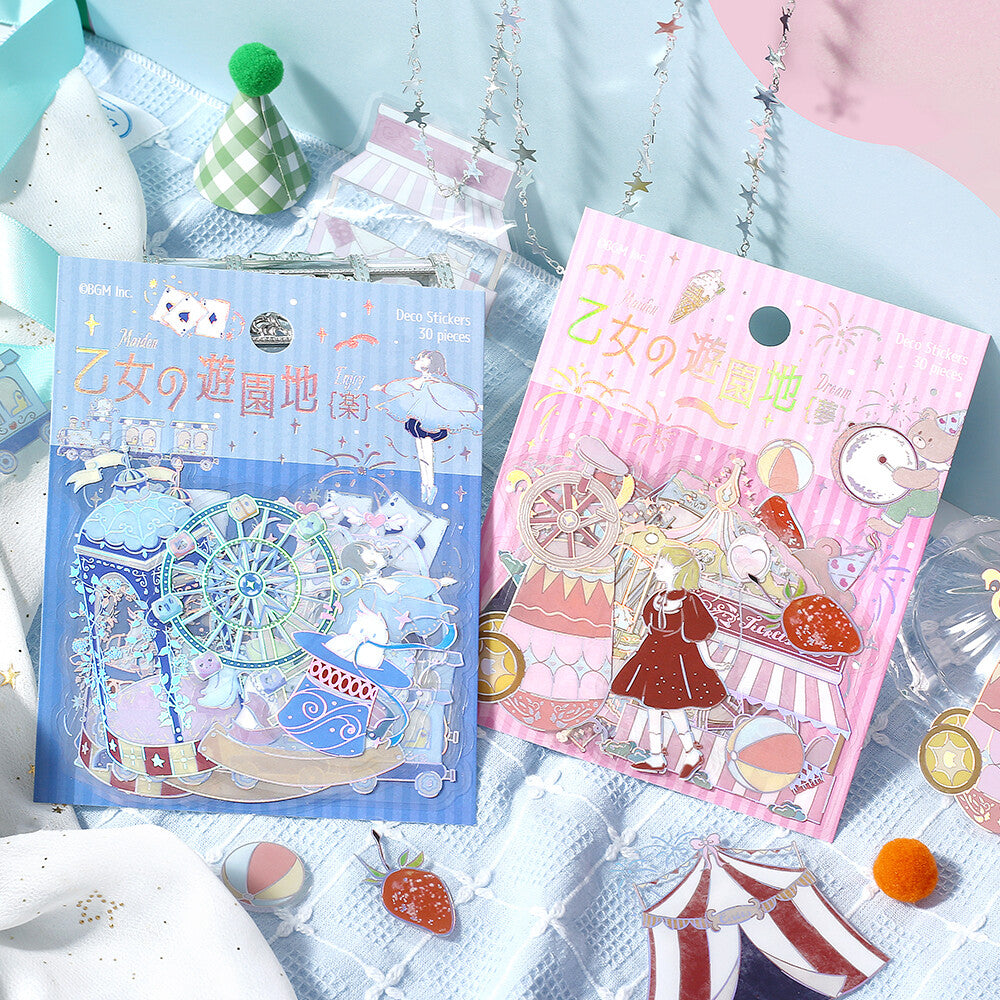 Two sticker books with colorful designs on a soft blue background