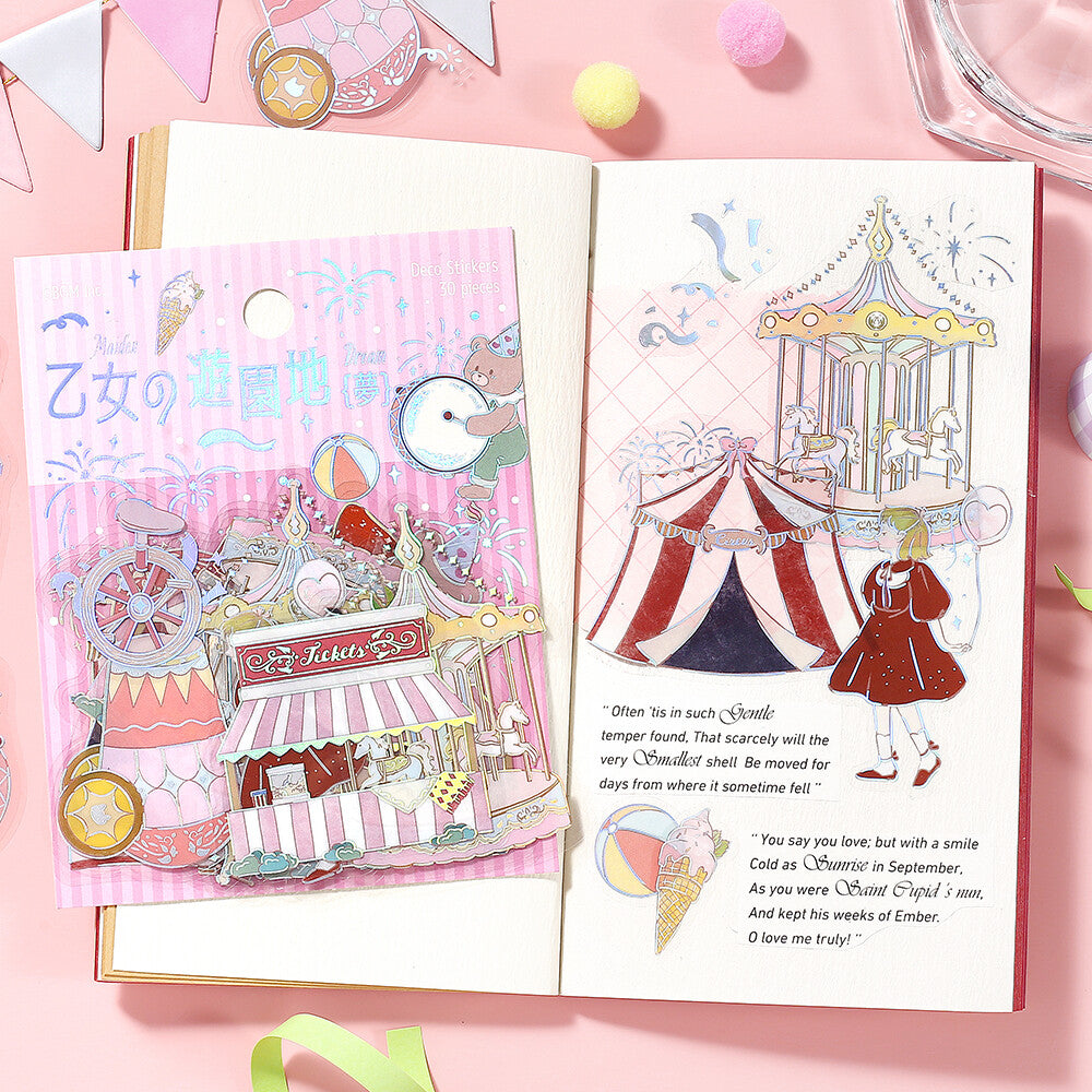 Illustrated book open to pages with a carousel and ice cream cone on a pink background