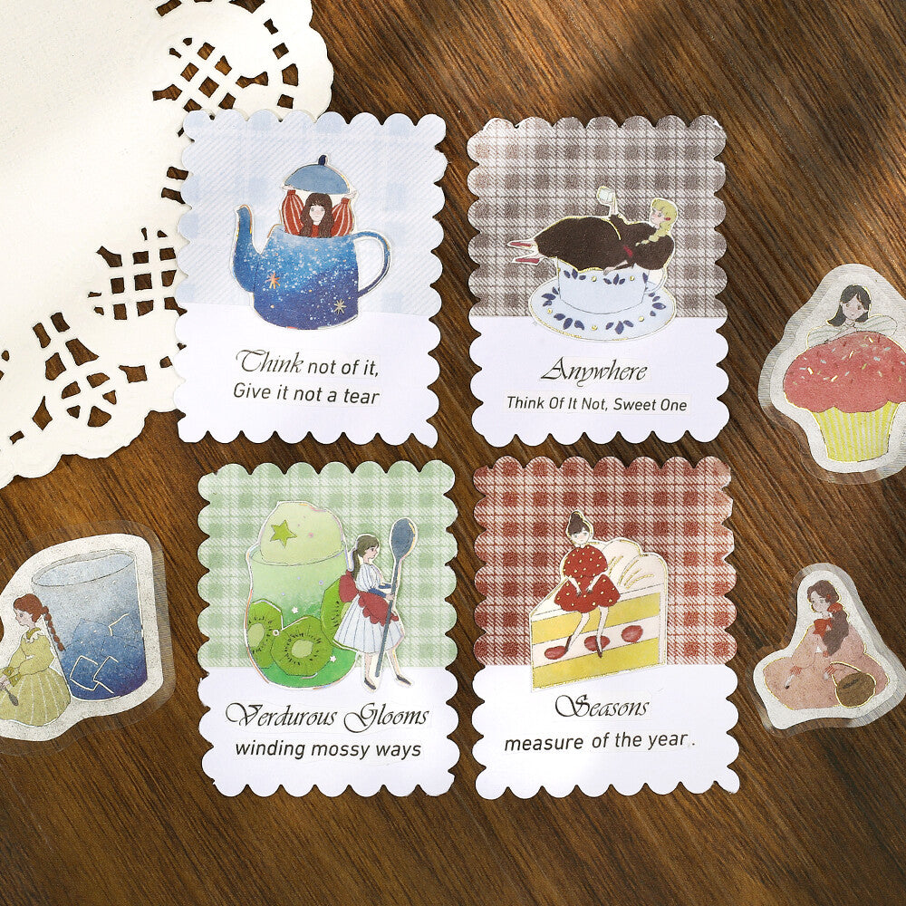 Set of decorative cards with illustrations and text on a wooden surface