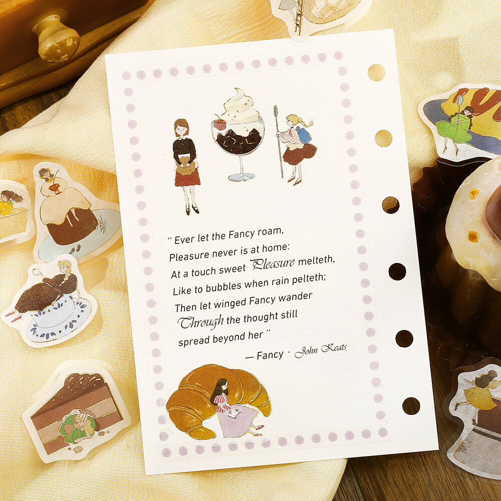 Sheet of stickers with illustrations and text on a wooden surface