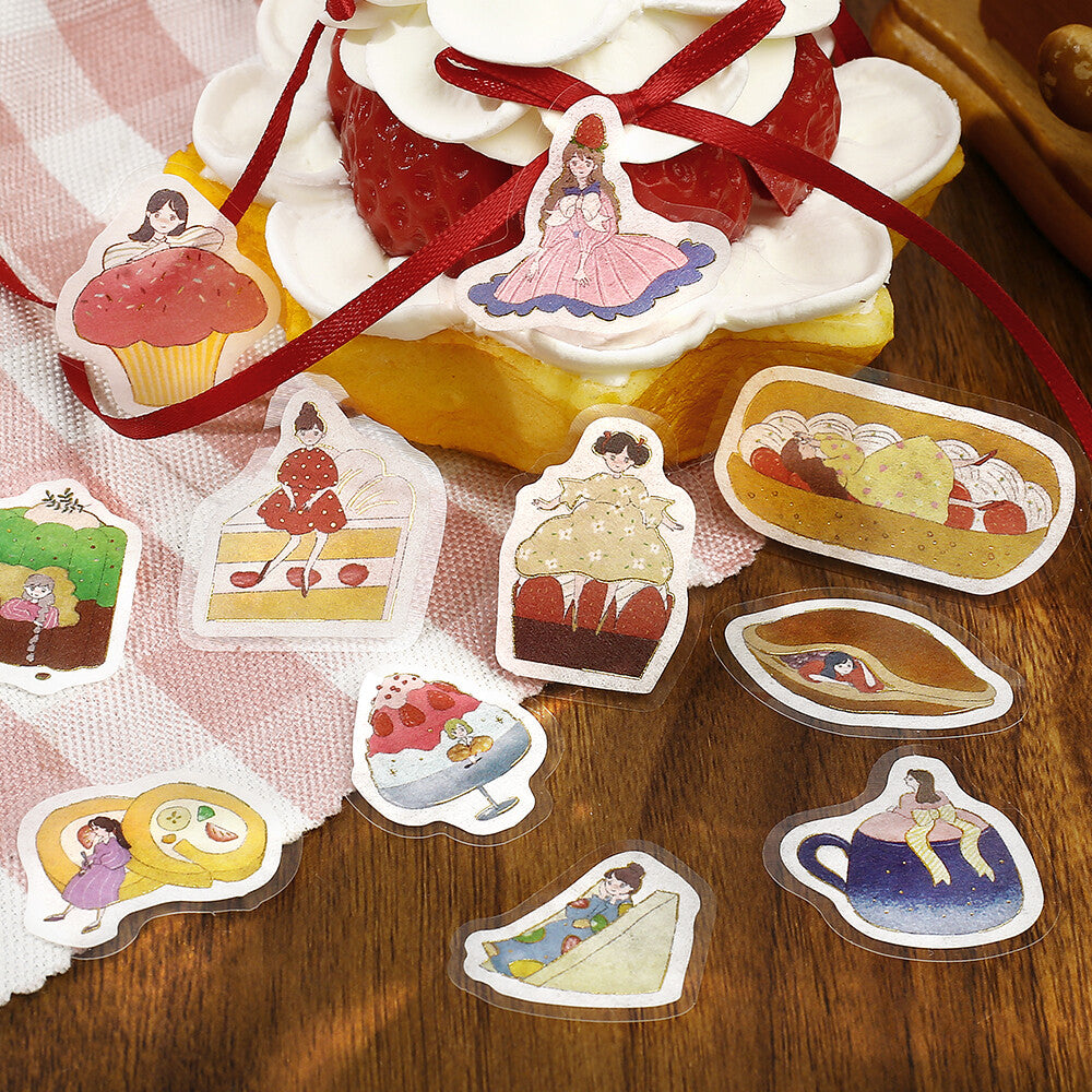 Sticker set with illustrations of desserts and a cake on a wooden surface.