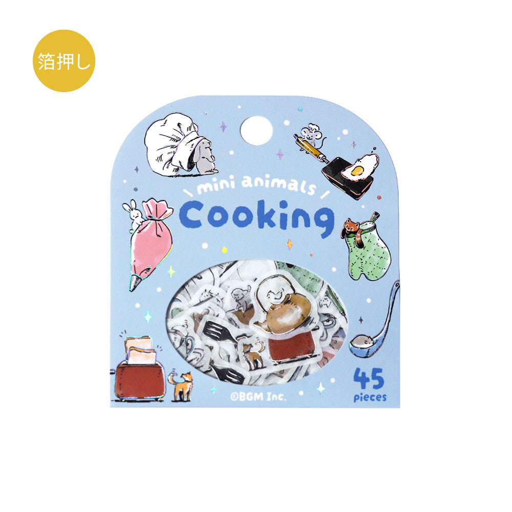 Packaging of mini animal figures themed around cooking on a light blue background.