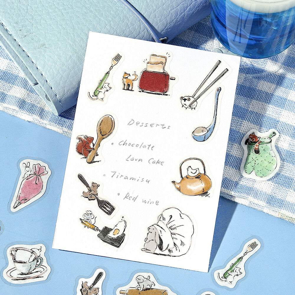 Set of food-themed stickers on a white card with a blue checkered fabric background