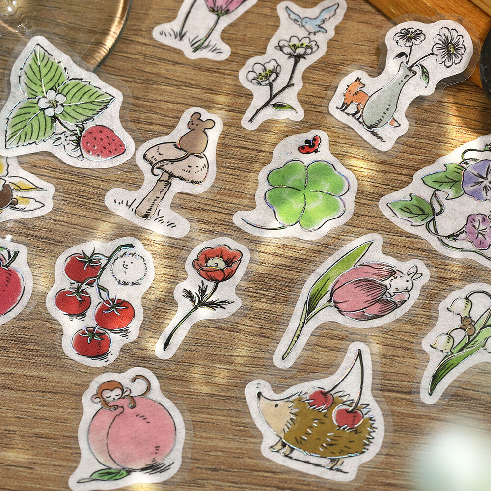 Collection of hand-drawn stickers on a wooden surface