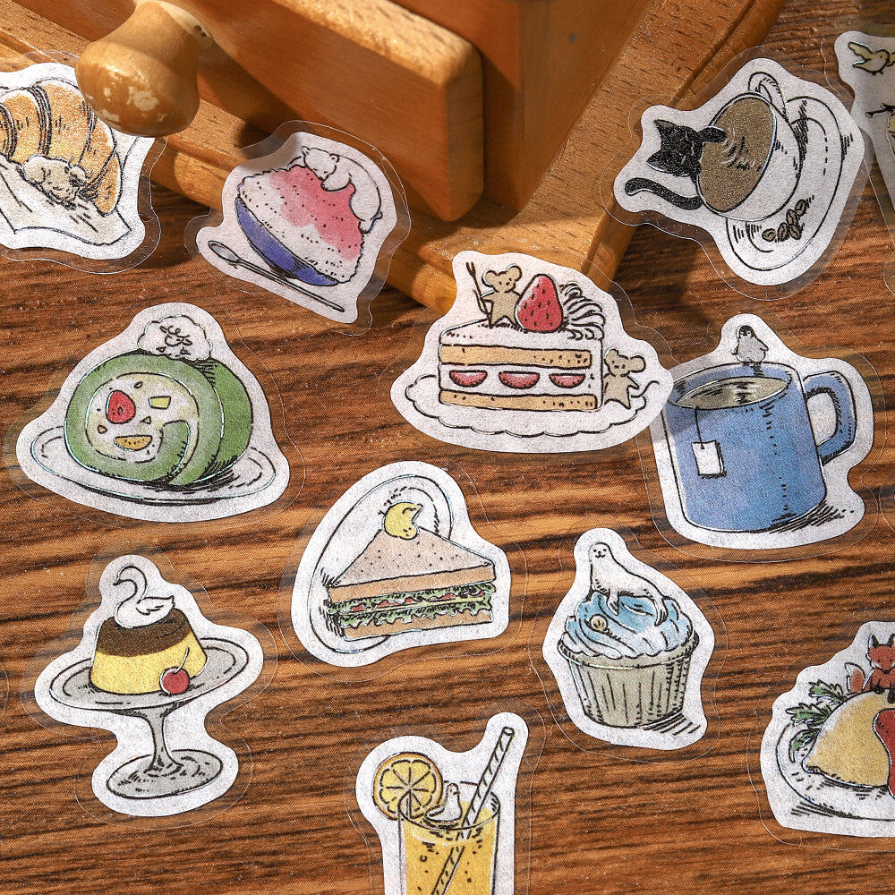Stickers of food and drinks on a wooden surface