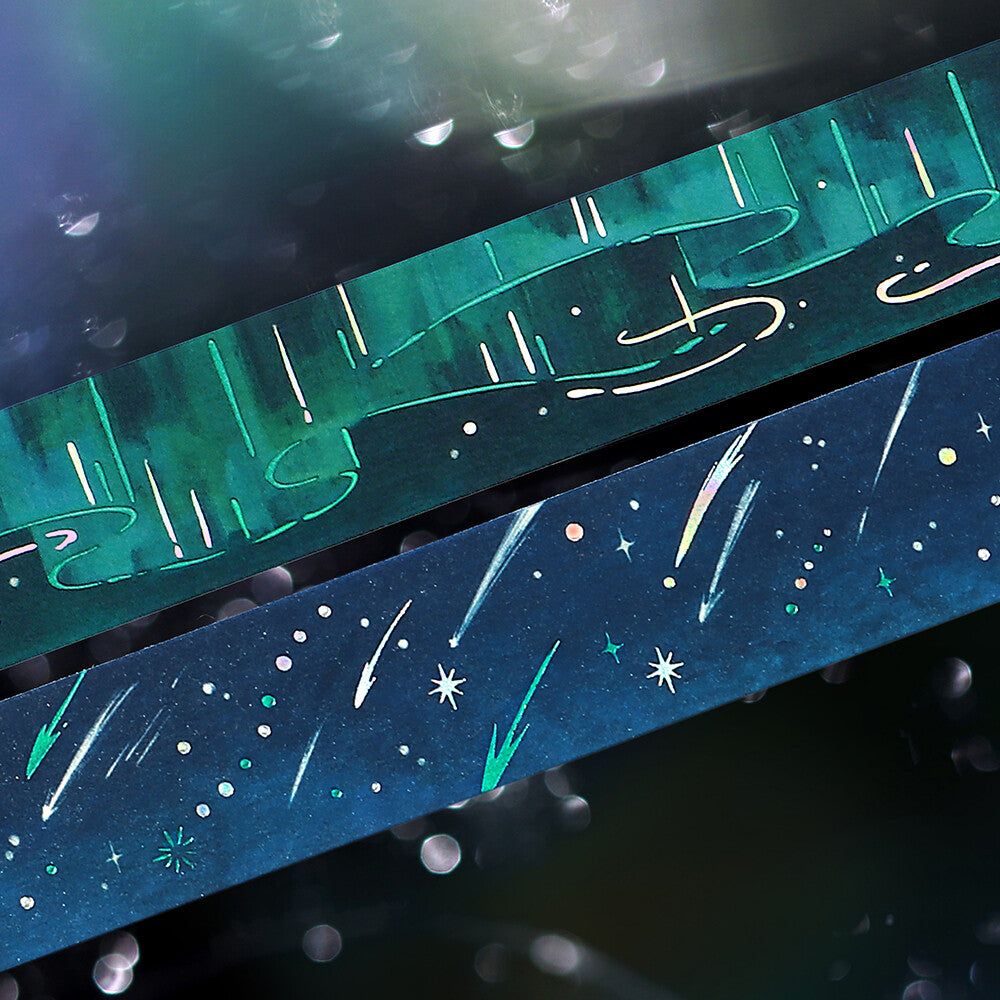 Two decorative washis with celestial designs on a dark background