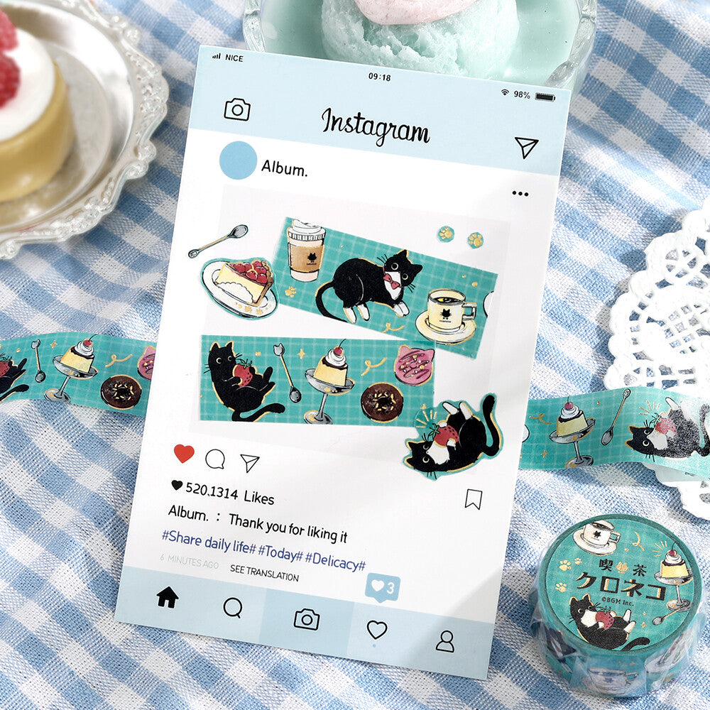 Phone screen showing Instagram album with cat-themed stickers on a checkered tablecloth.