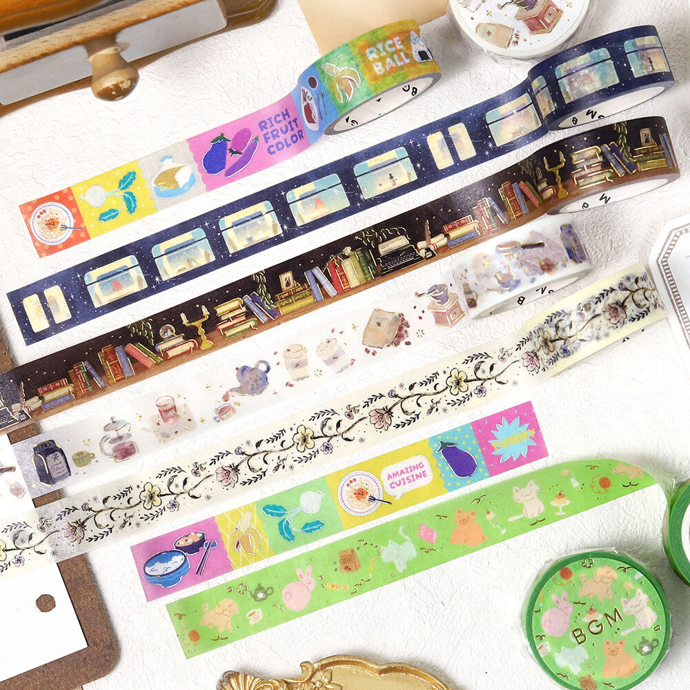 Set of colorful washi tape rolls with various designs on a white surface.