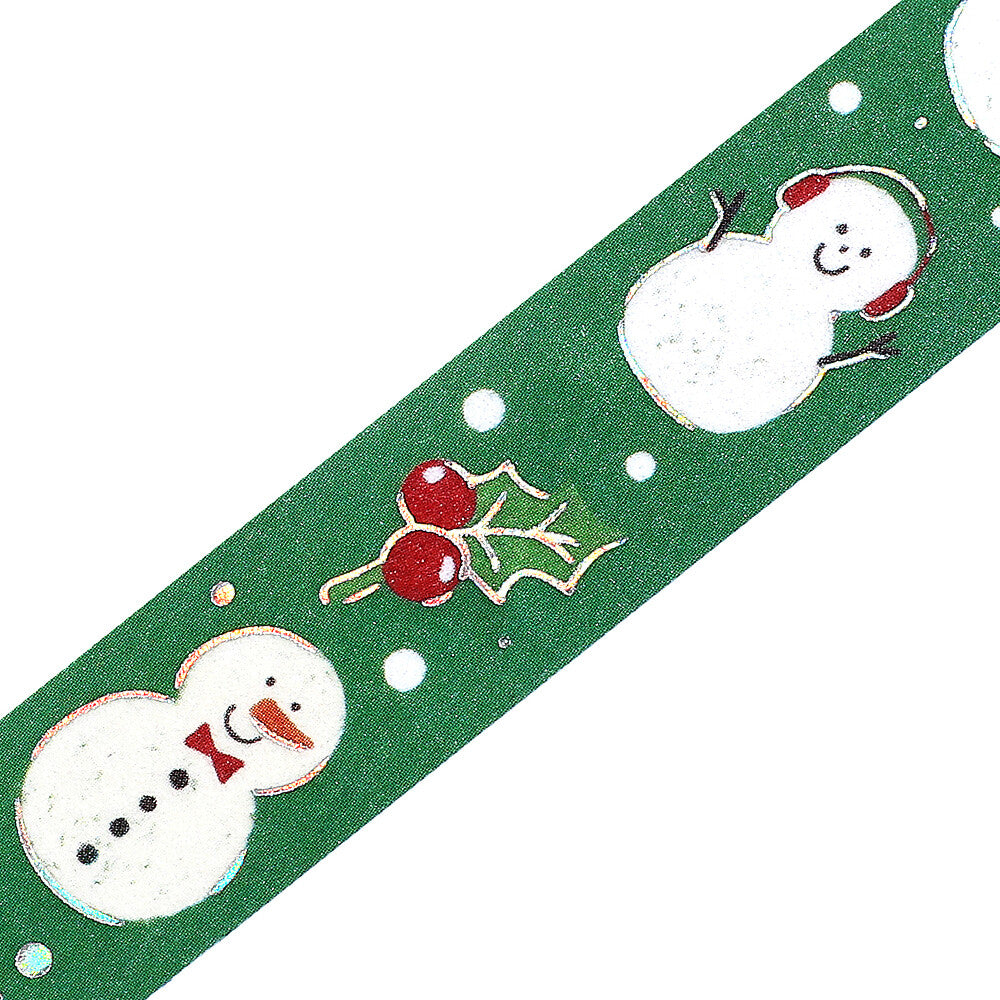 Green washi tape with snowman and holly design on a white background