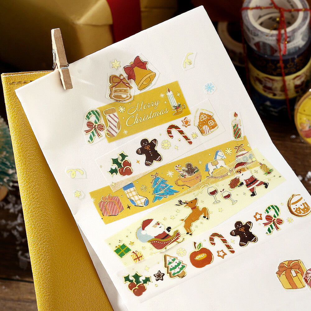 Sheet of Christmas-themed stickers with a paper clip on a white background.