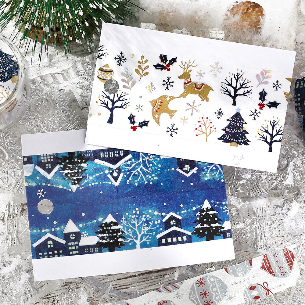 Two Christmas-themed cards on a textured surface with decorative elements.