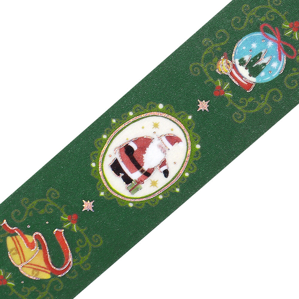 Decorative green washi tape with Christmas-themed designs on a white background