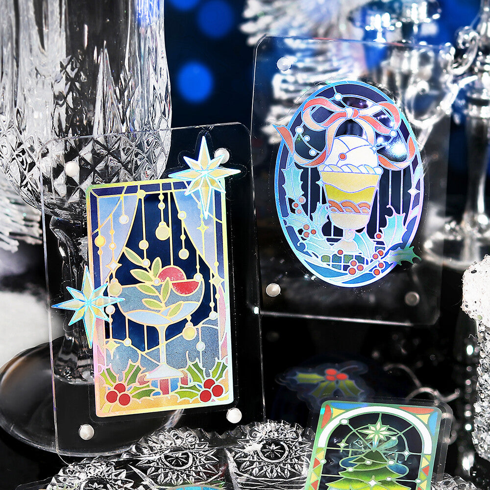 Decorative glass pieces with colorful designs on a dark background