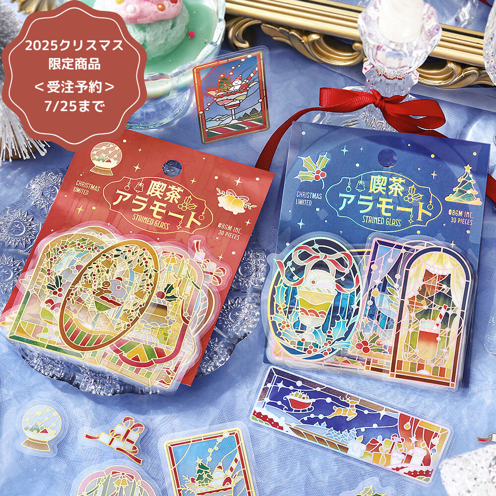 Packaged Christmas-themed stickers with decorative elements on a blue surface.