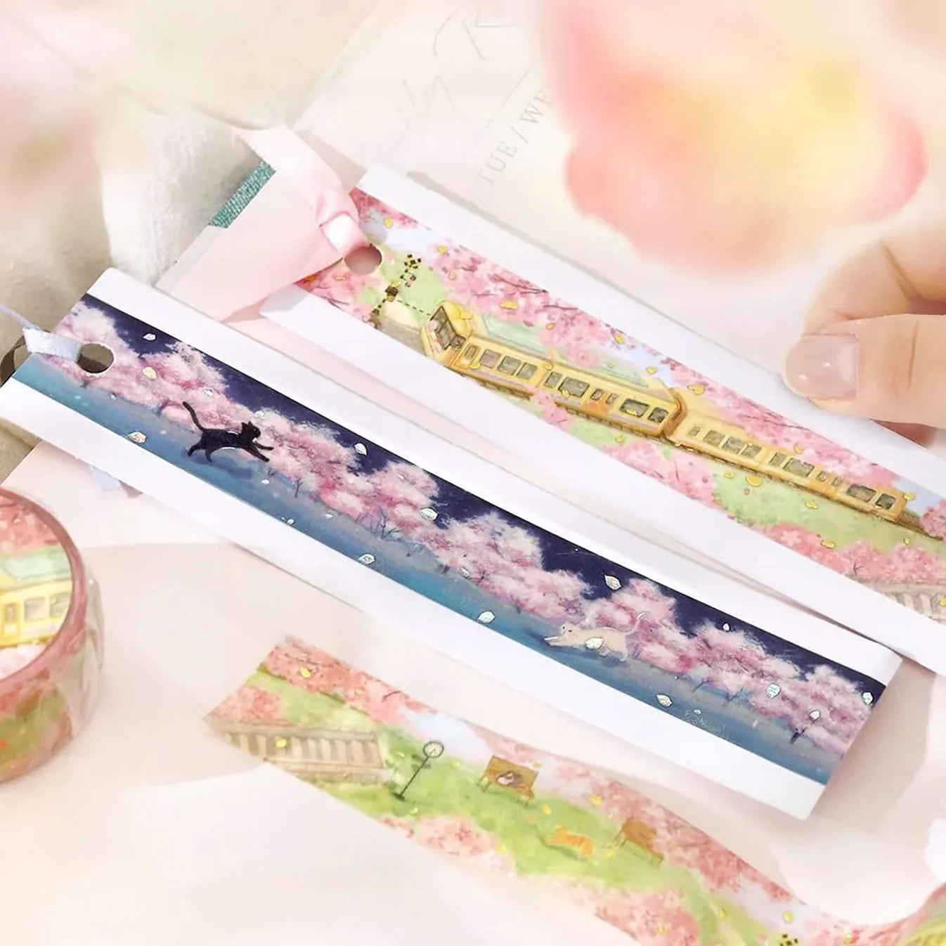 Decorative tape with cherry blossom and train design on a white background