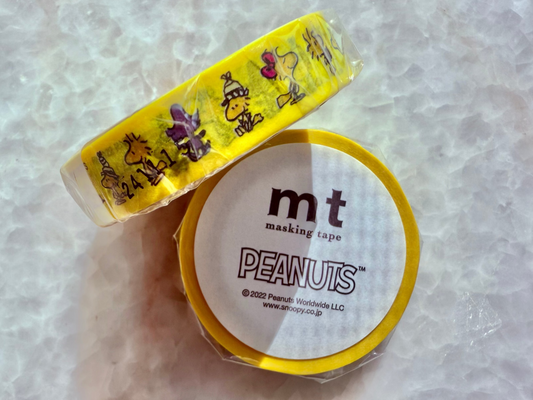 Peanuts-themed masking tape with a yellow border on a light gray background