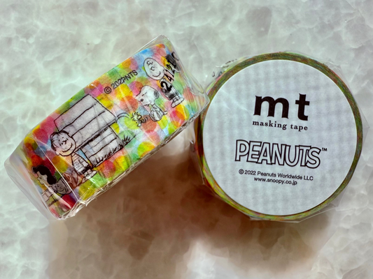 Roll of mt masking tape with Peanuts character design on a light gray background