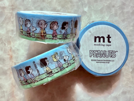 Two rolls of Peanuts-themed masking tape on a light background