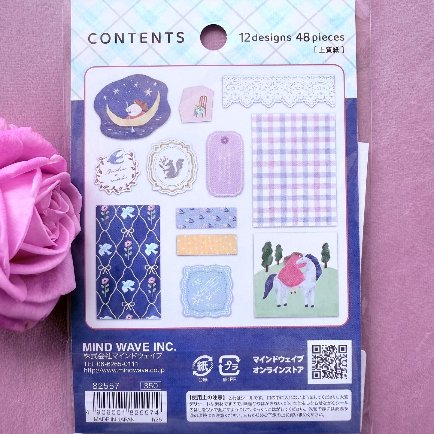 Packaging of decorative stickers with a pink flower on a purple background