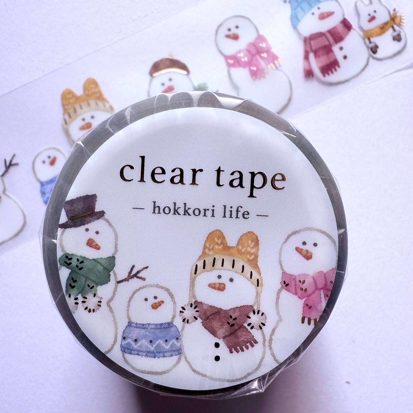 Clear tape with snowman design on a white background