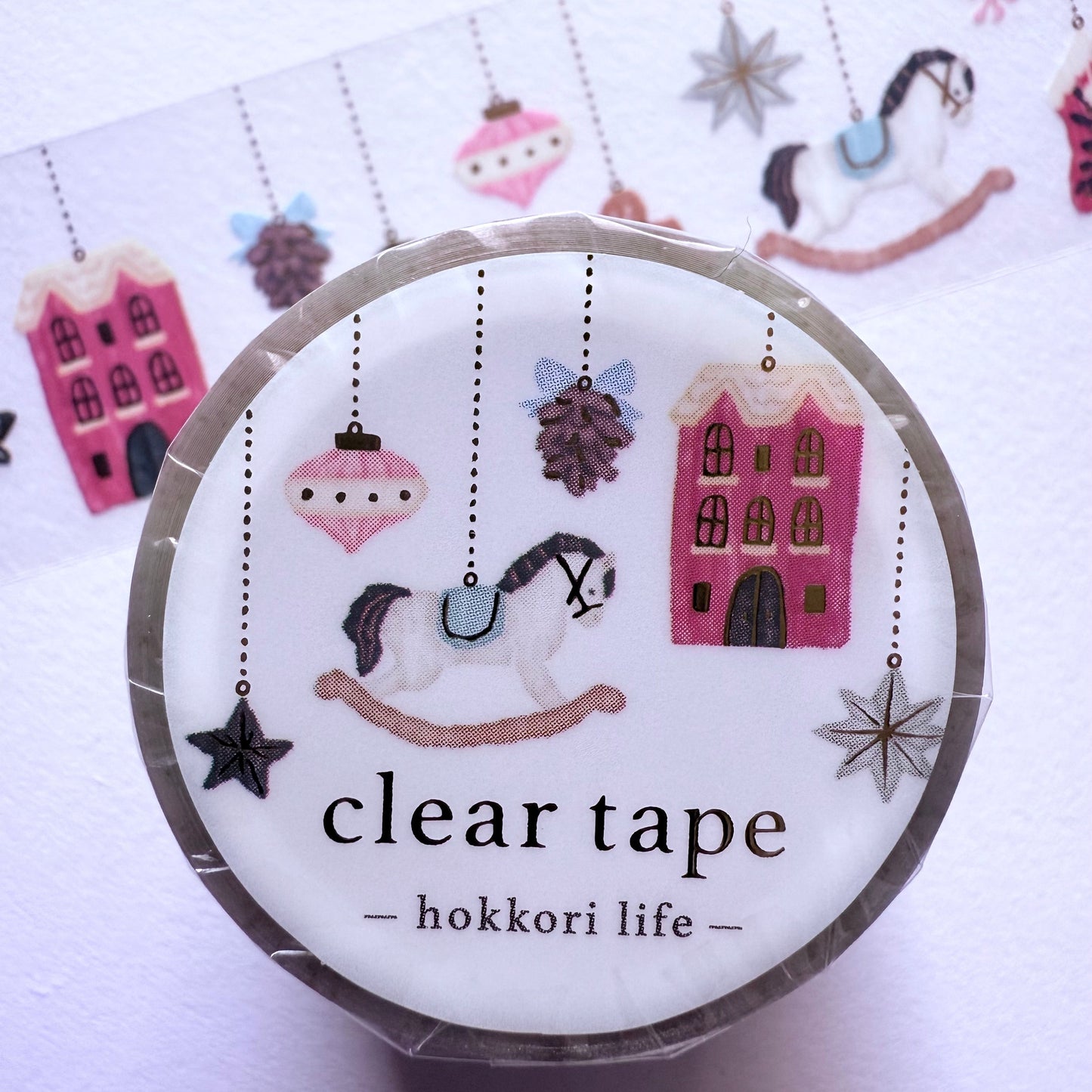 Clear tape with decorative labels on a white background