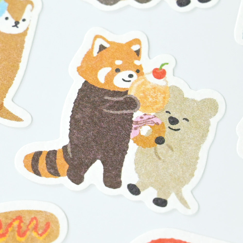 Sticker of a red panda and a bear holding a donut on a white background