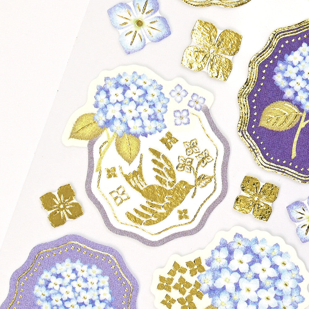 Decorative stickers with floral and bird designs on a white background