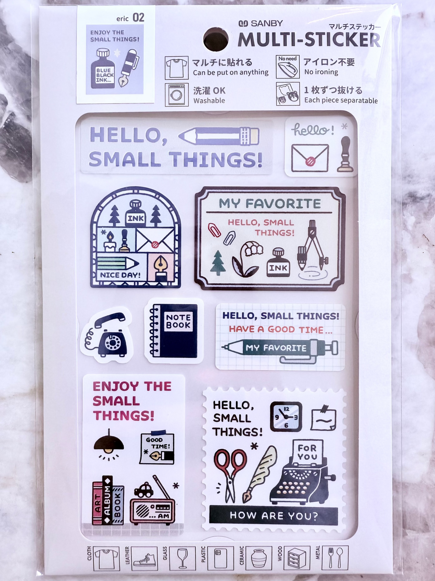 Packaging of a multi-sticker set with various designs on a textured surface