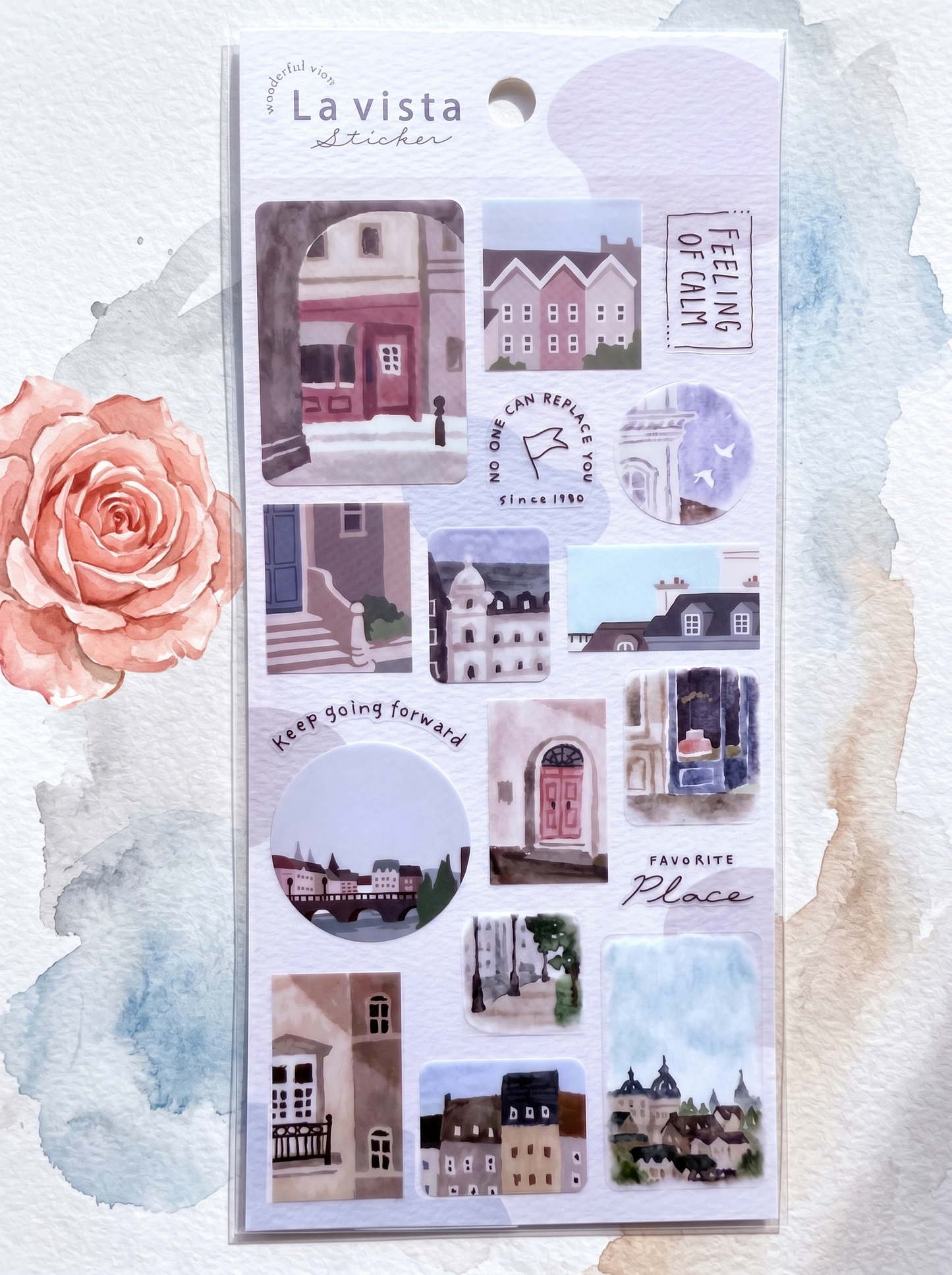 Pack of La Vista stickers with illustrated buildings and text on a watercolor background