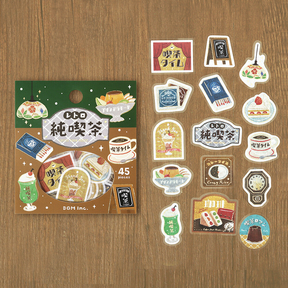 Set of illustrated stickers resembling a tea package on a wooden surface