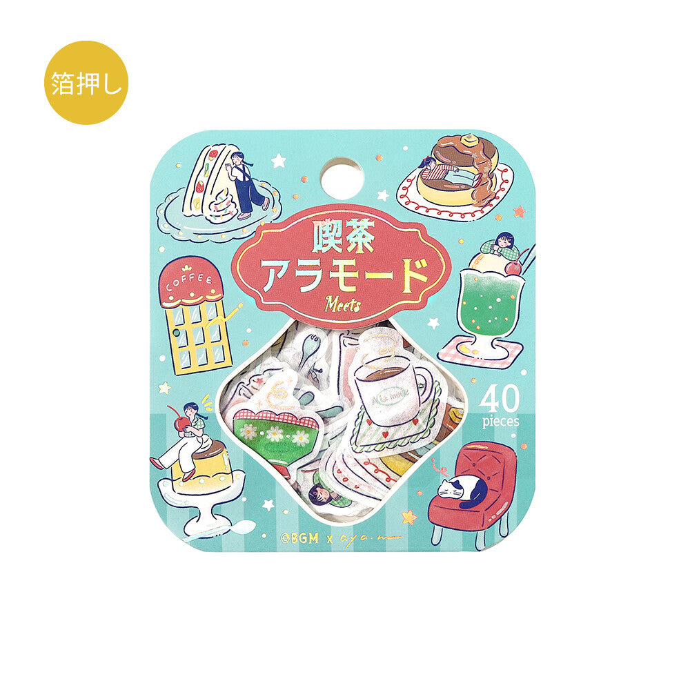 A packaged set of decorative stickers or decals with a light blue rounded square backing card. The card features cute illustrated tea-themed graphics, including a teacup, coffee shop, drink, cake, and a sleeping cat, plus Japanese text and a yellow circular badge.
