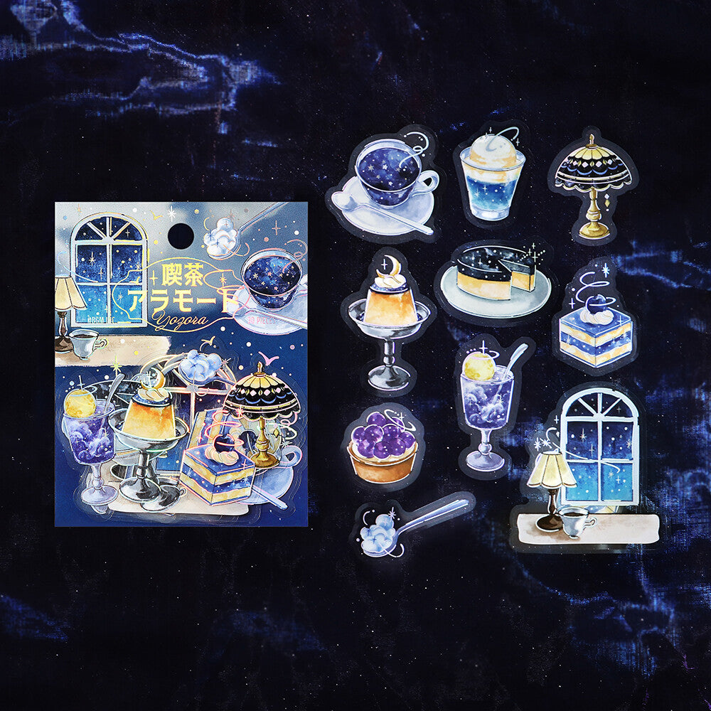 Set of decorative charms resembling desserts and a window on a dark background