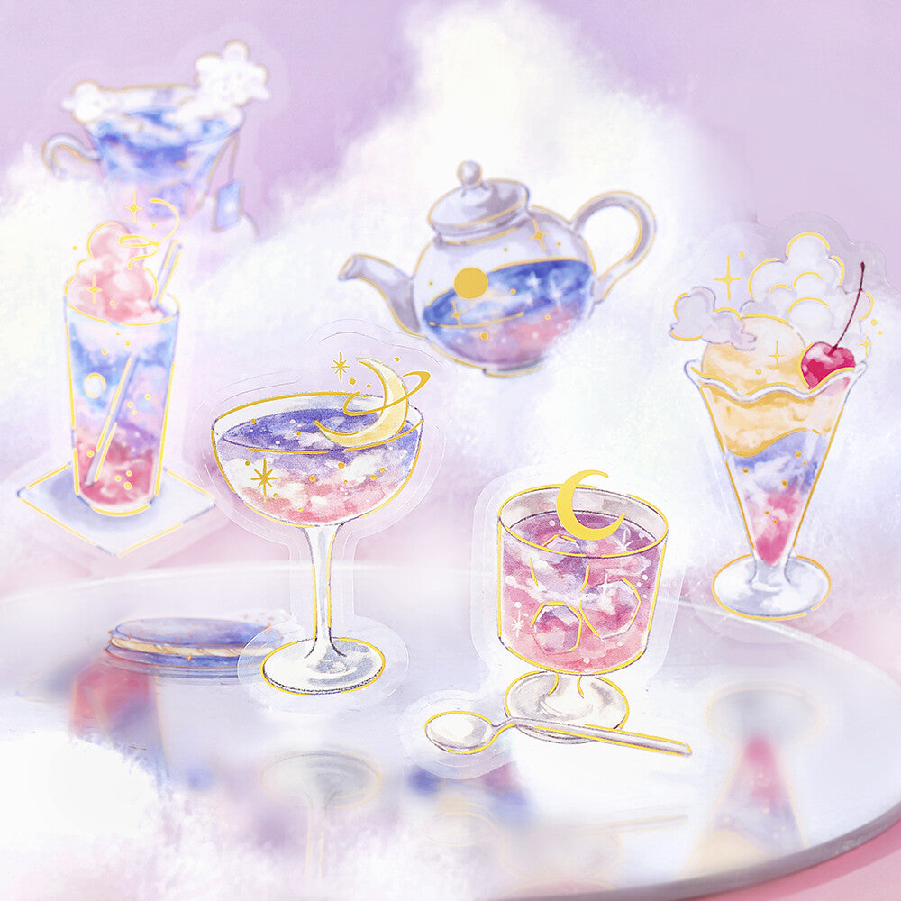 A whimsical pastel illustration of dessertware and drinks arranged on a reflective surface, including a teapot, glasses, and cups filled with pink and blue celestial-patterned desserts, set against a soft lavender cloud-like background.