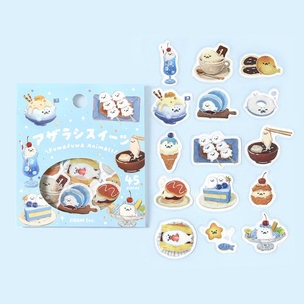 A package of cute cartoon dessert stickers next to several individual die-cut stickers showing various illustrated sweets, drinks, and snacks on a pale blue background.