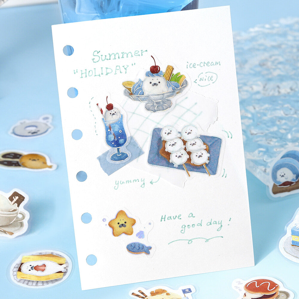 Sheet of decorative stickers with summer-themed illustrations on a blue background