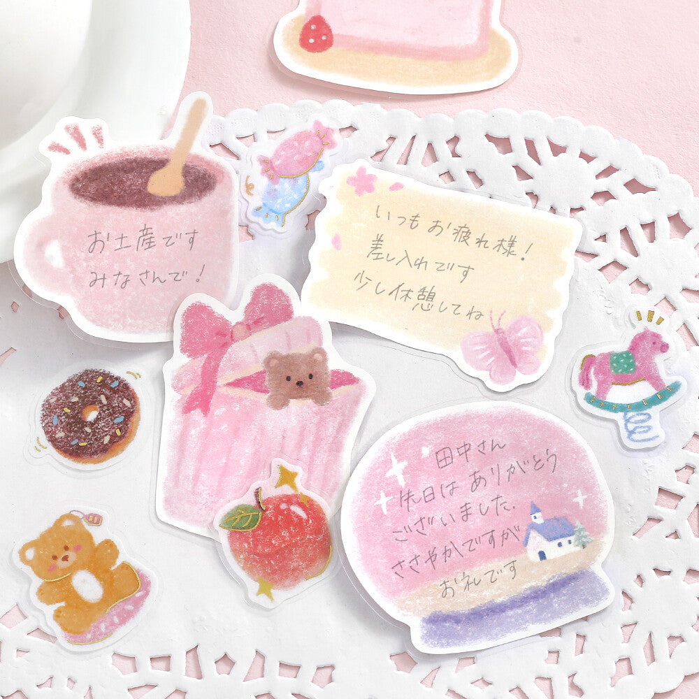Set of cute illustrated stickers on a decorative doily