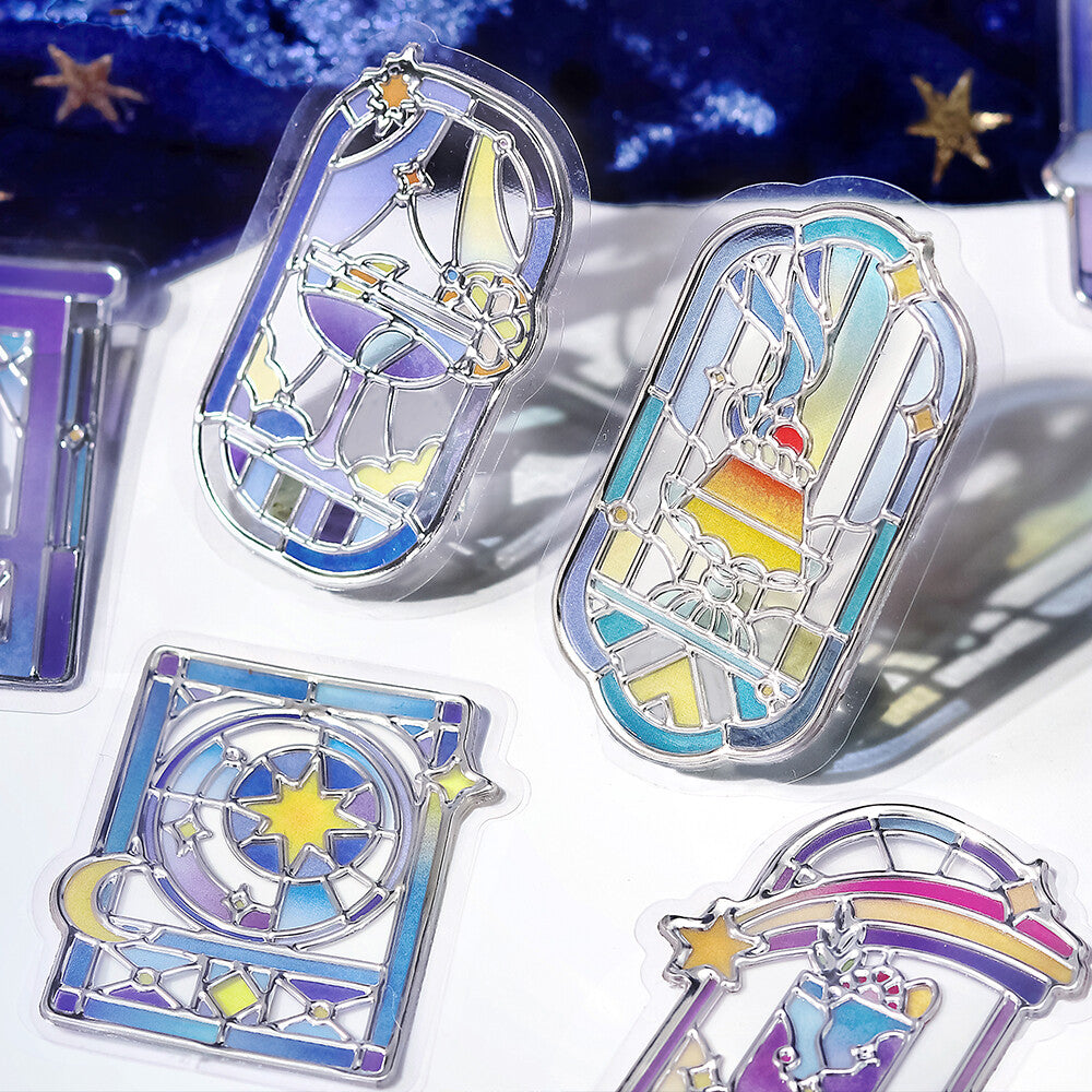 4 blue themed stickers seals with pictures of desserts and night scenes on a blue velvet and white background