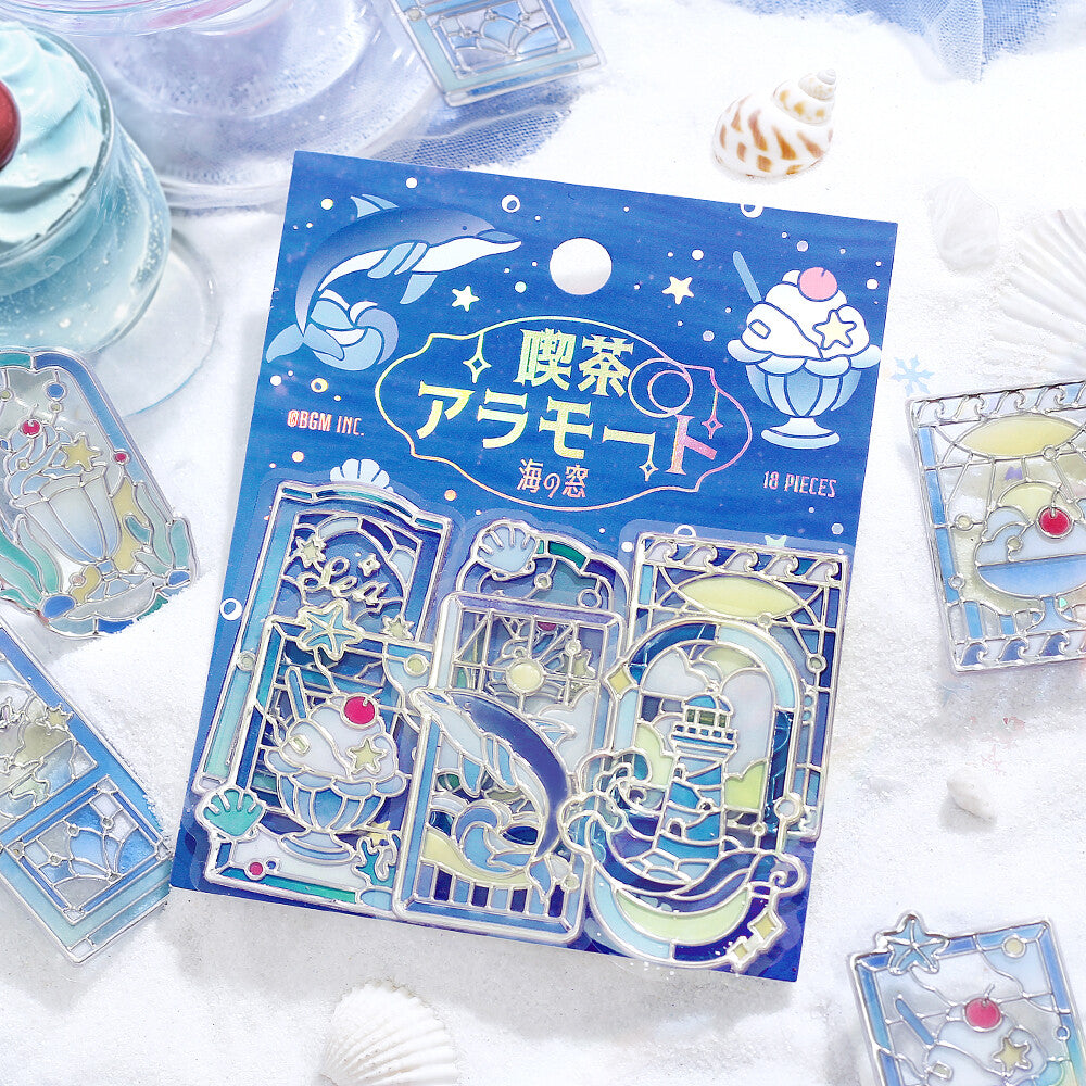 Packet of blue themed marine stickers with a stained glass design on a snow background