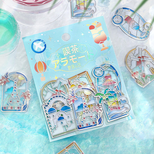 Pack of stickers by BGM featuring coloured stained glass with scenes of famous buildings over the world on a cloth background
