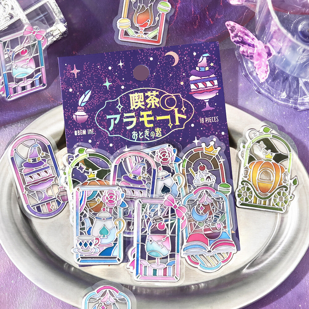 Packet of stickers with purple themed stained glass pictures on metal plate background