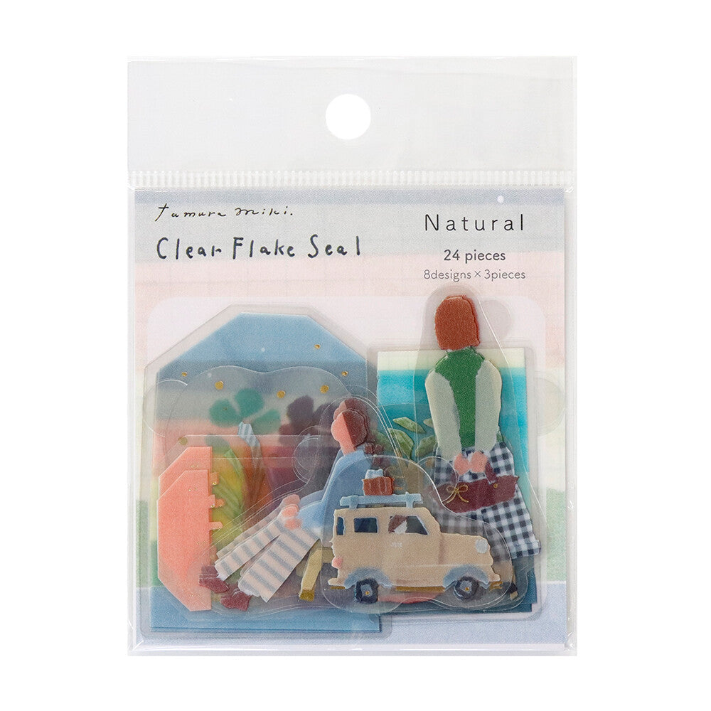 Packaged clear flake seals with scenic designs on a white background