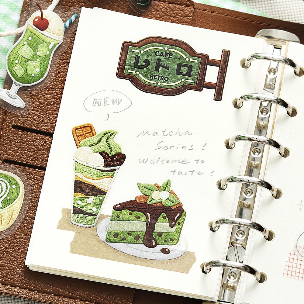 A page out of a binder planner with 3 stickers with coffee themes