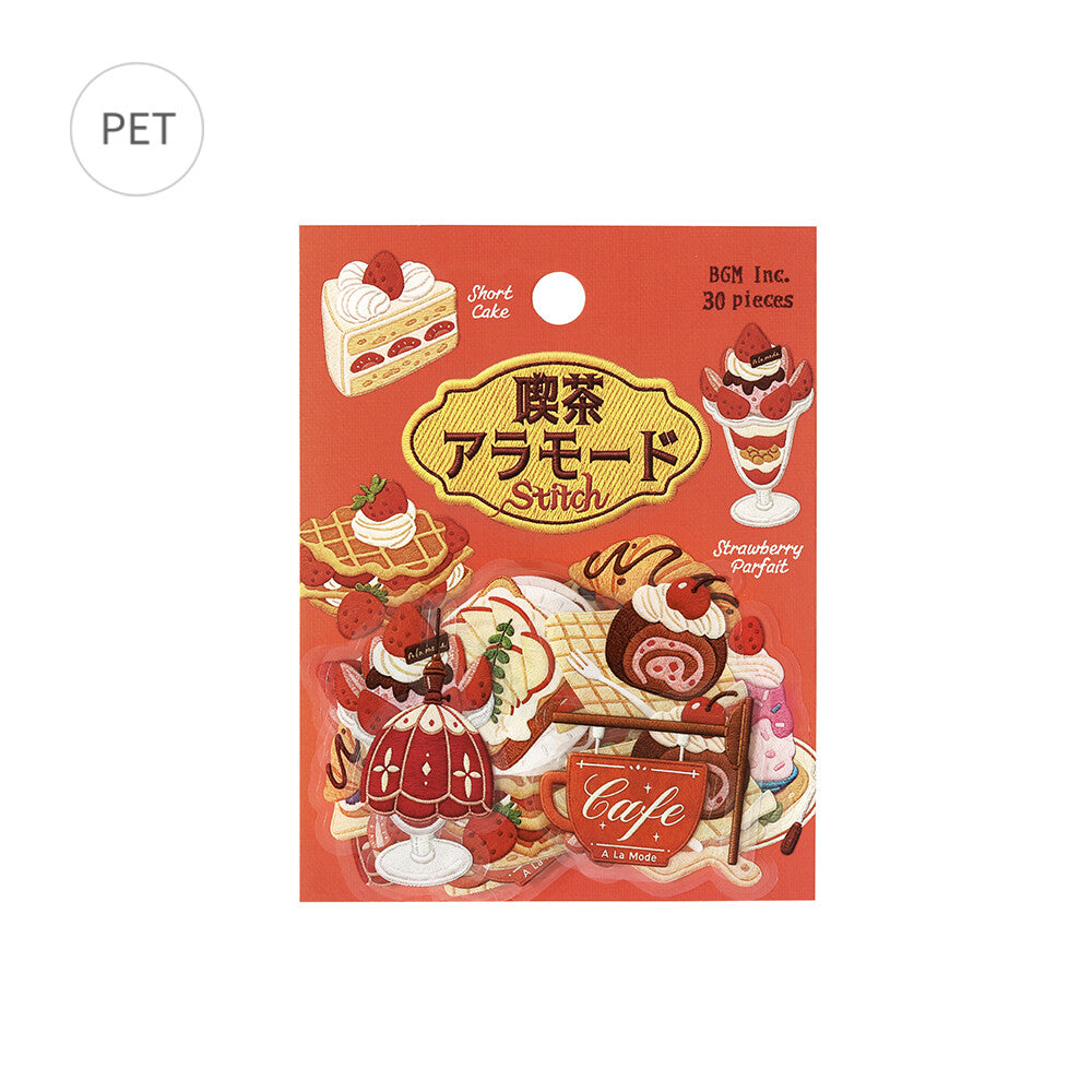 A package of BGM Inc. Strawberry Perfect cherry-shaped decorative pieces, featuring a red-orange background with illustrations of desserts, cakes, and a cafe scene, with Japanese text.